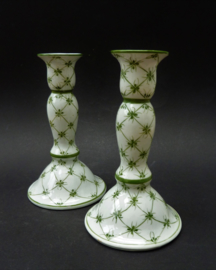 A pair of green sprig porcelain candlesticks