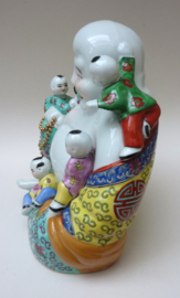 Large Chinese porcelain sitting Budai with five playing boys