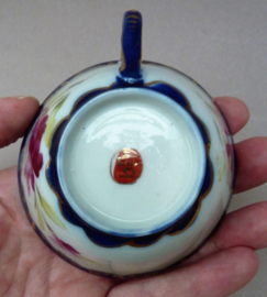 Japanese Meiji porcelain demitasse cup with saucer