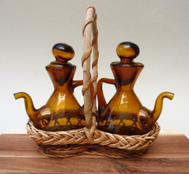 Spanish brown glass oil and vinegar set in wicker basket