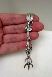 Silver plated reticulated sugar tongs with bird claws