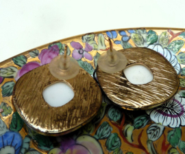 Mid Century gold tone earrings with green stone
