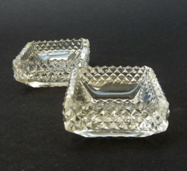 A pair of square cut crystal salt cellars