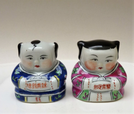 A pair of Chinese famille rose porcelain boy girl figurines