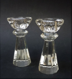 A pair of facet cut crystal candlesticks