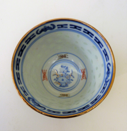 A pair of Chinese Wanyu rice grain porcelain tea bowls