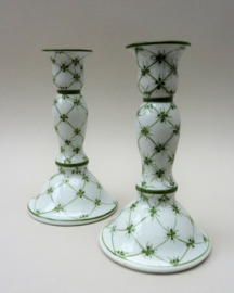 A pair of green sprig porcelain candlesticks