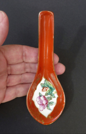 Chinese red porcelain spoon with blossom