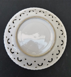 Lusterware tea cup with feet and reticulated saucer