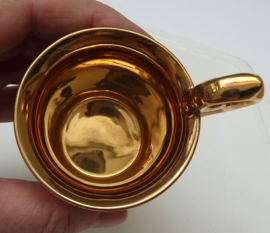 Gilded pink porcelain footed cabinet cup