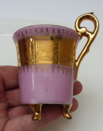 Gilded pink porcelain footed cabinet cup