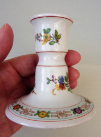 A pair of antique Schierholz Plaue porcelain candlesticks