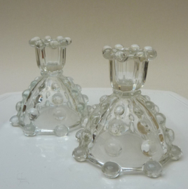 A pair of glass Art Deco style glass balls candlesticks