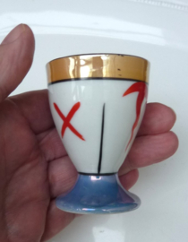 Een paar Japanse Art Deco lusterware porseleinen eierdopjes