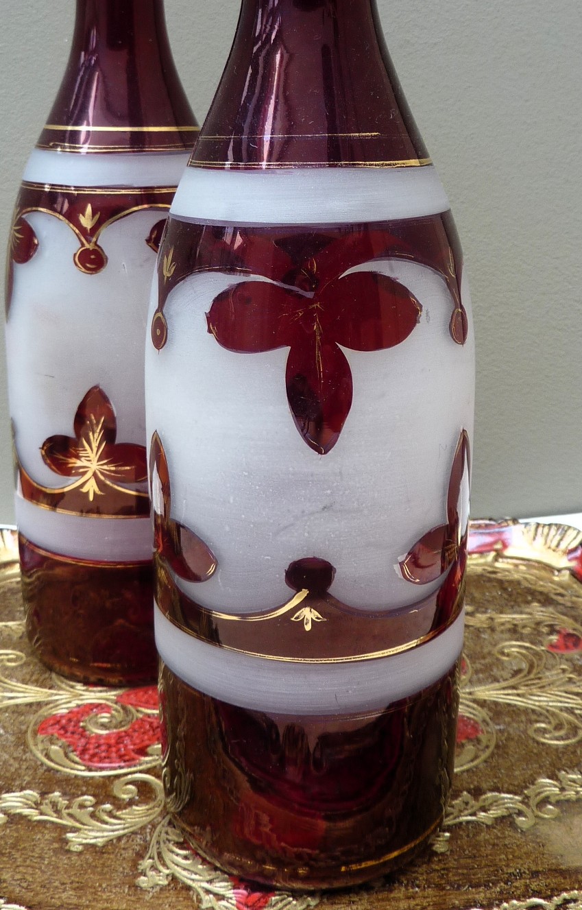 A pair of Bohemian ruby red glass bottle decanters late 19th century