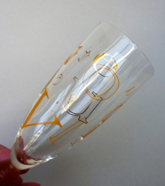 A pair of Veuve Cliquot Ponsardin Alphabet champagne flute glasses