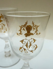 A pair of French gilt engraved wine glasses 19th century