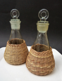 Mid Century oil and vinegar bottles in wicker baskets