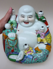 Large Chinese porcelain sitting Budai with five playing boys
