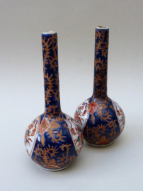A pair of vintage small Imari porcelain bottle vases