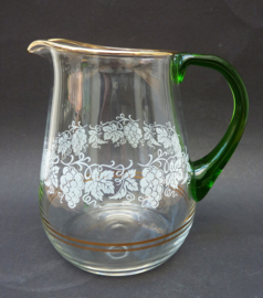 Glass wine pitcher with vine decoration