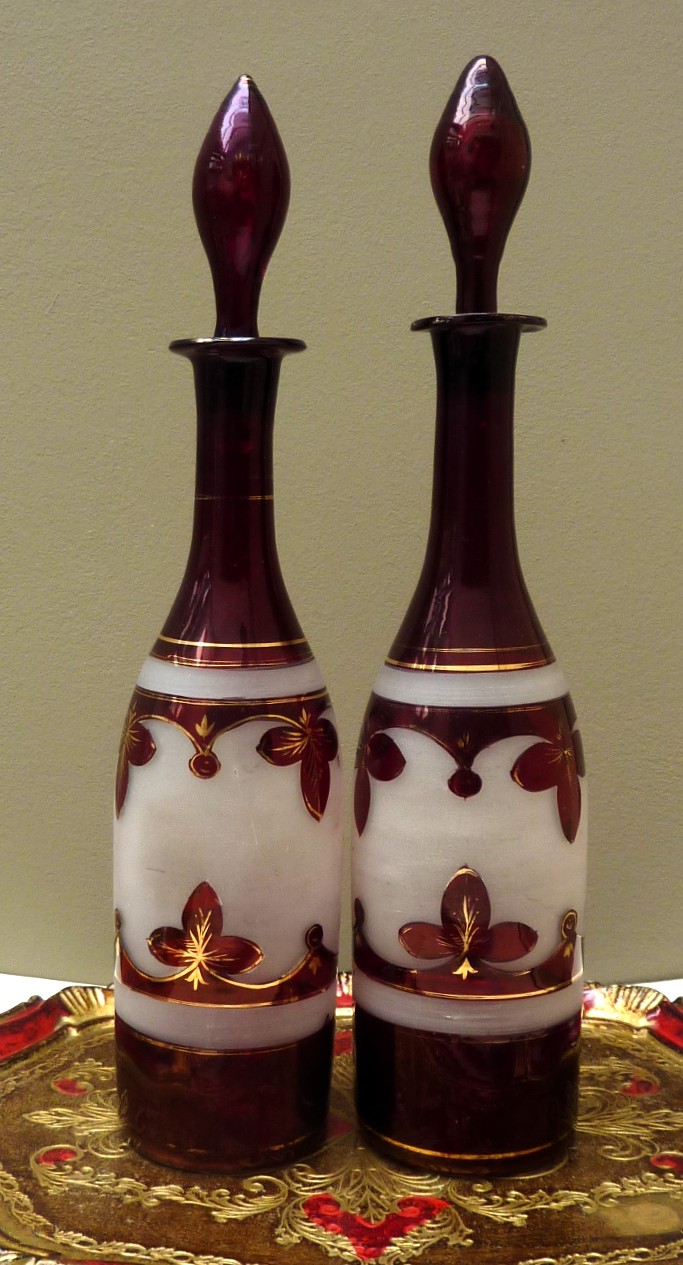 A pair of Bohemian ruby red glass bottle decanters late 19th century