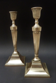 A pair of 18th century English copper neo classical candlesticks