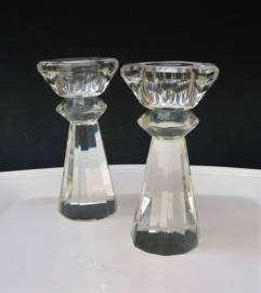 A pair of facet cut crystal candlesticks