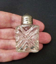 Miniature pressed glass salt shaker silver plated cap