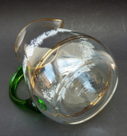 Glass wine pitcher with vine decoration