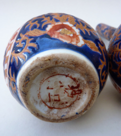 A pair of vintage small Imari porcelain bottle vases