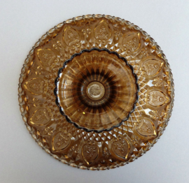 KIG Maleisie - Fleur de Lis - amber pressed glass pedestal serving plate