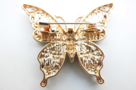 Broche blauwe vlinder.