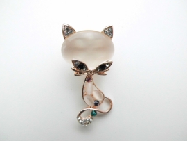Broche poes.