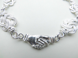 Zilveren mattenklopper/vriendschap bracelet.