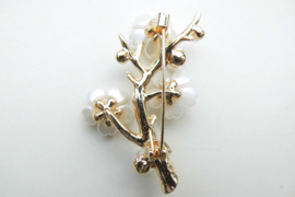 Broche pruimen bloesem.