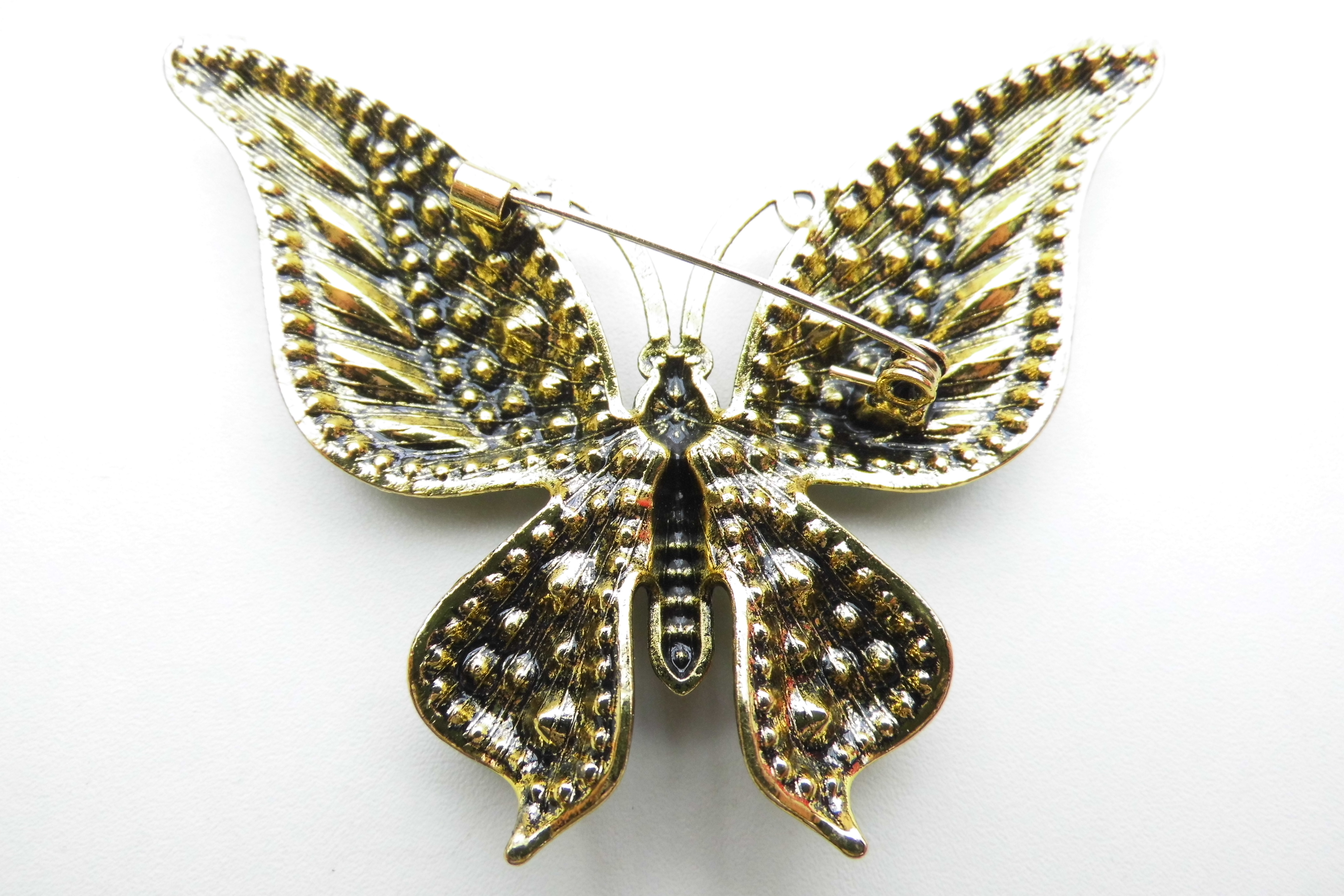 Broche grote kleurrijke vlinder.