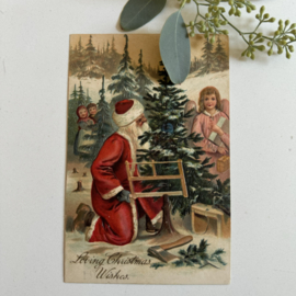 Kerstman zaagt boom