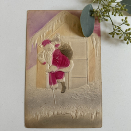 Kerstman in raam