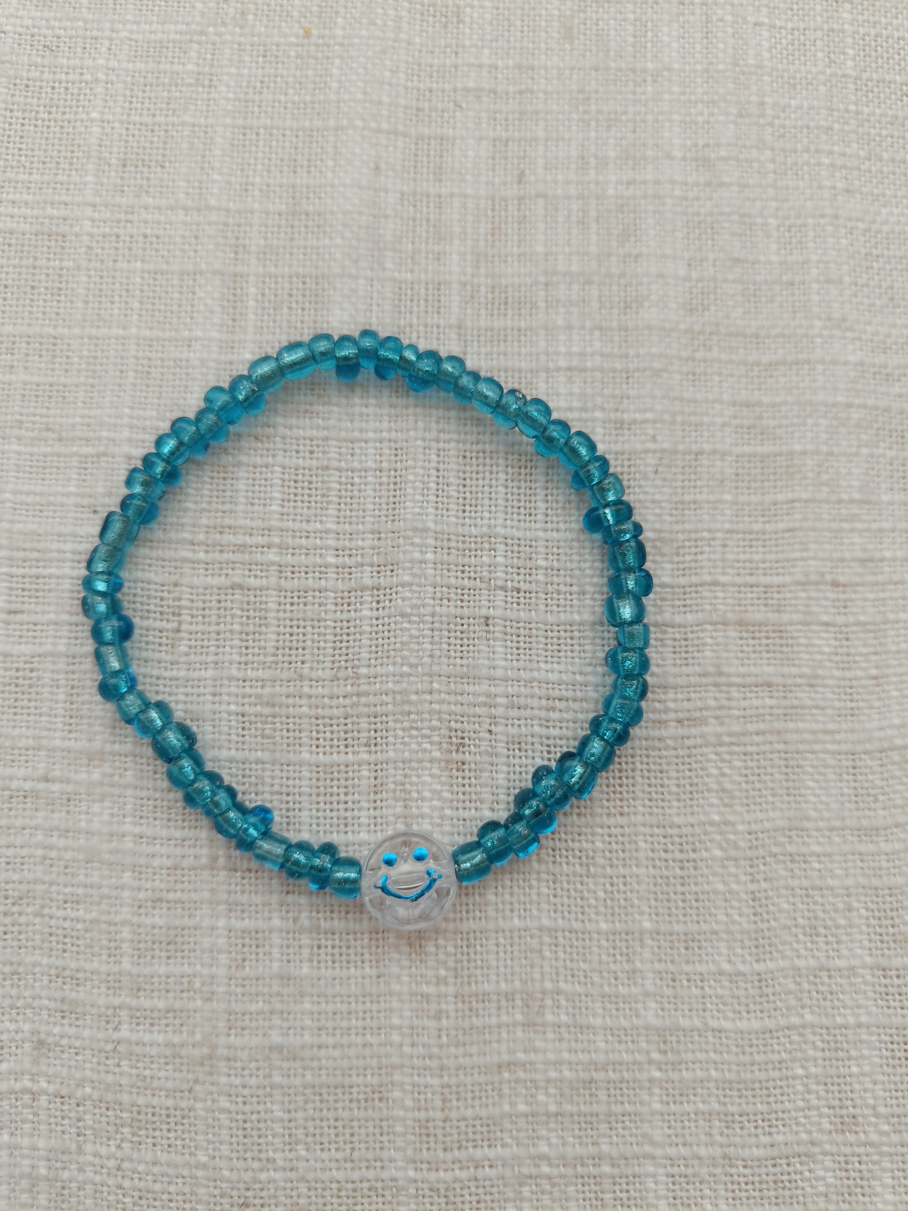Armbandje - smiley blauw