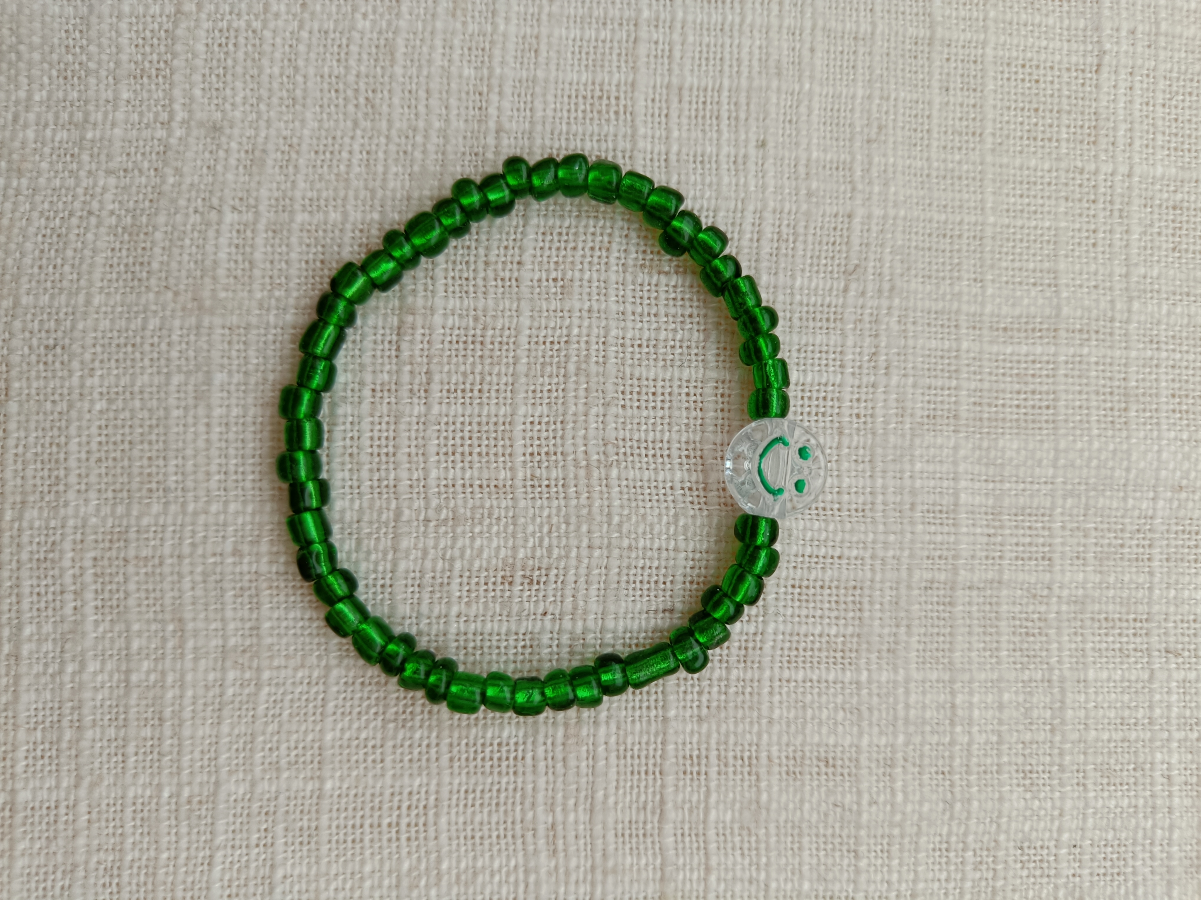 Armbandje - smiley groen