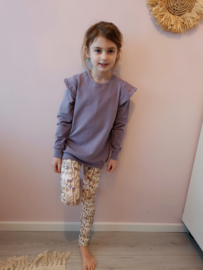 Legging vlinder distel