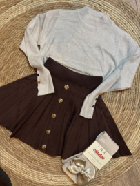 Prachtig goudkleurig shirtje met knoopjes .