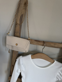 Mooi uitgewerkt jurkje met tasje in het zandkleur/offwhite.