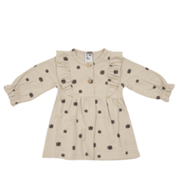 Klein baby kleding heerlijk zacht jersey jurkje in zand met mauve.