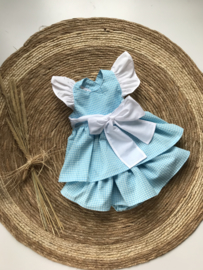 Vrolijke jurk met bijpassende bloomer in aqua met wit.