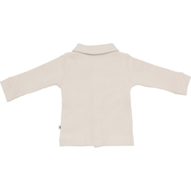 Stoer truitje/ over blouse van Klein babykleding in het zand.