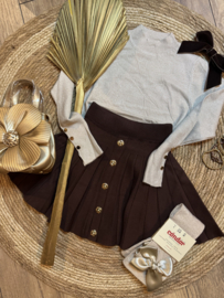 Prachtig goudkleurig shirtje met knoopjes .