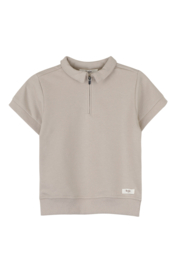 Baje studio gebreide polo teba in het zandkleur.