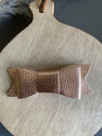 Prachtige leren rosé goudkleurige haarstrik .